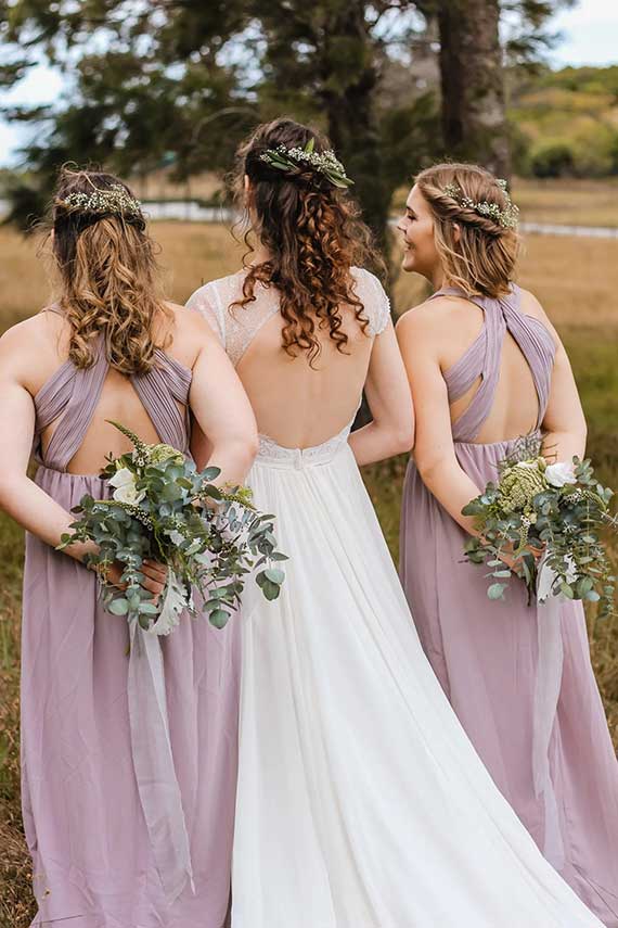 Bride and bridesmaids with finished wedding hairstyles