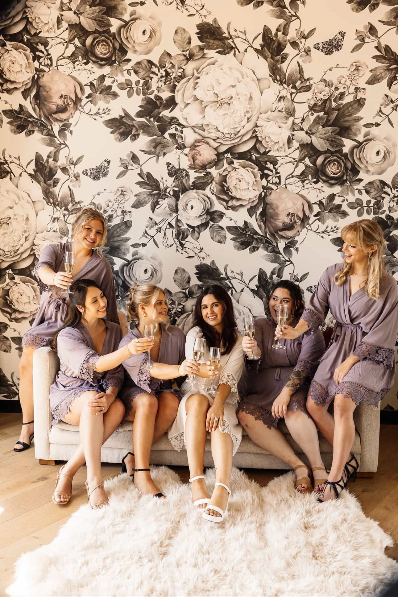 Bride and bridesmaids sharing a toast before the ceremony