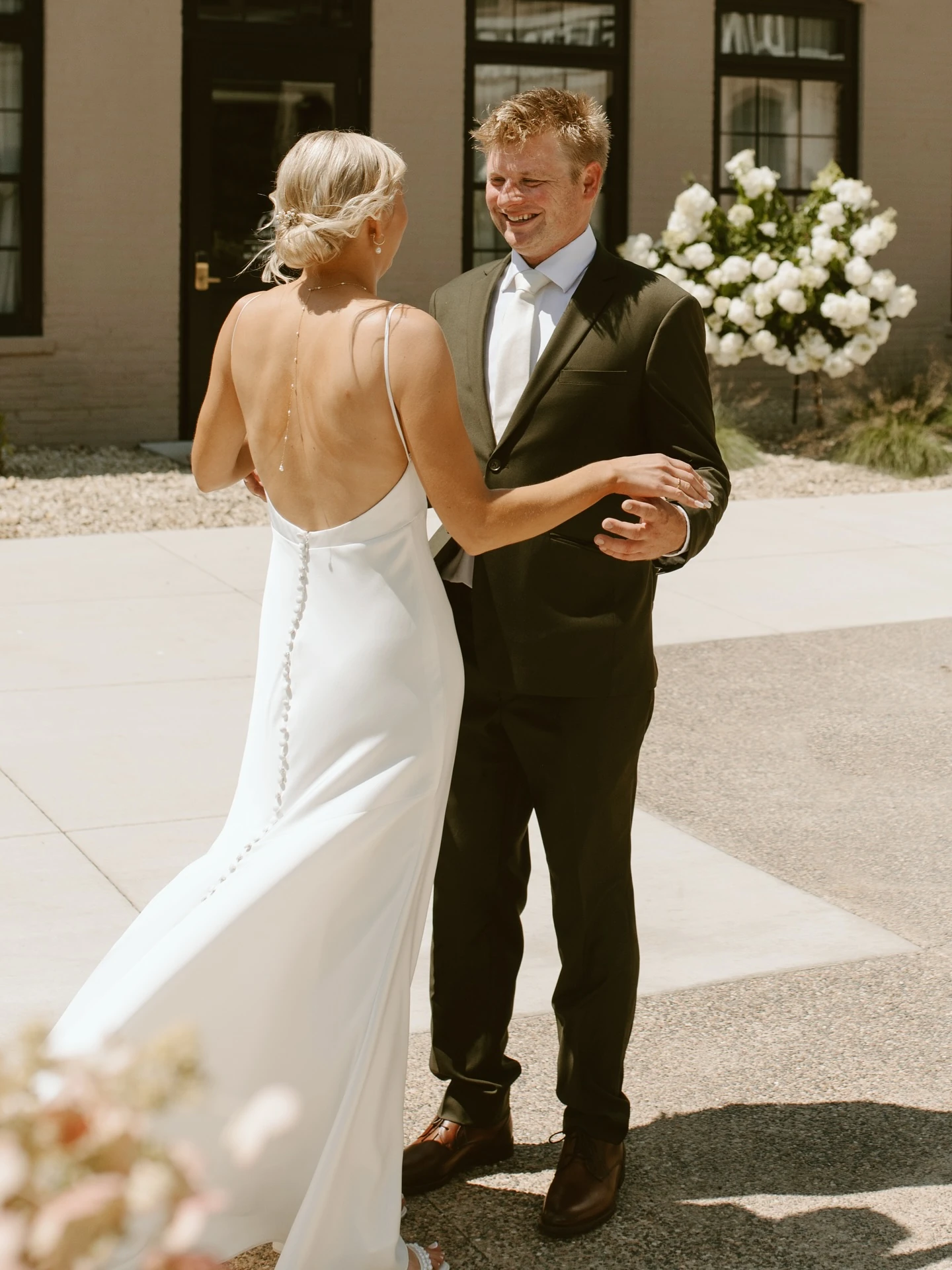 Bride and groom together outside their wedding venue